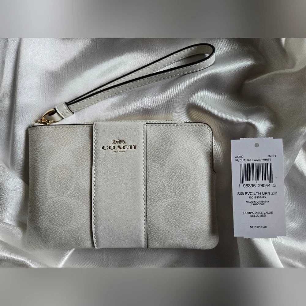 Coach White and Cream Signature Monogrammed Wristlet.